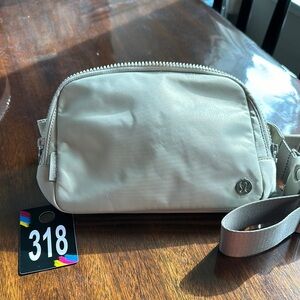318,NWT Lululemon Athletica Everywhere Tan Belt Bag with Design